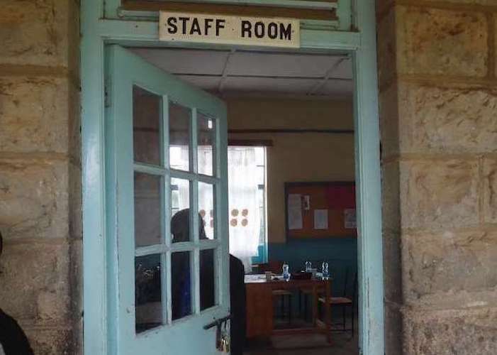 an open door leading to the staffroom of a school in the Maasai Mara, Kenya