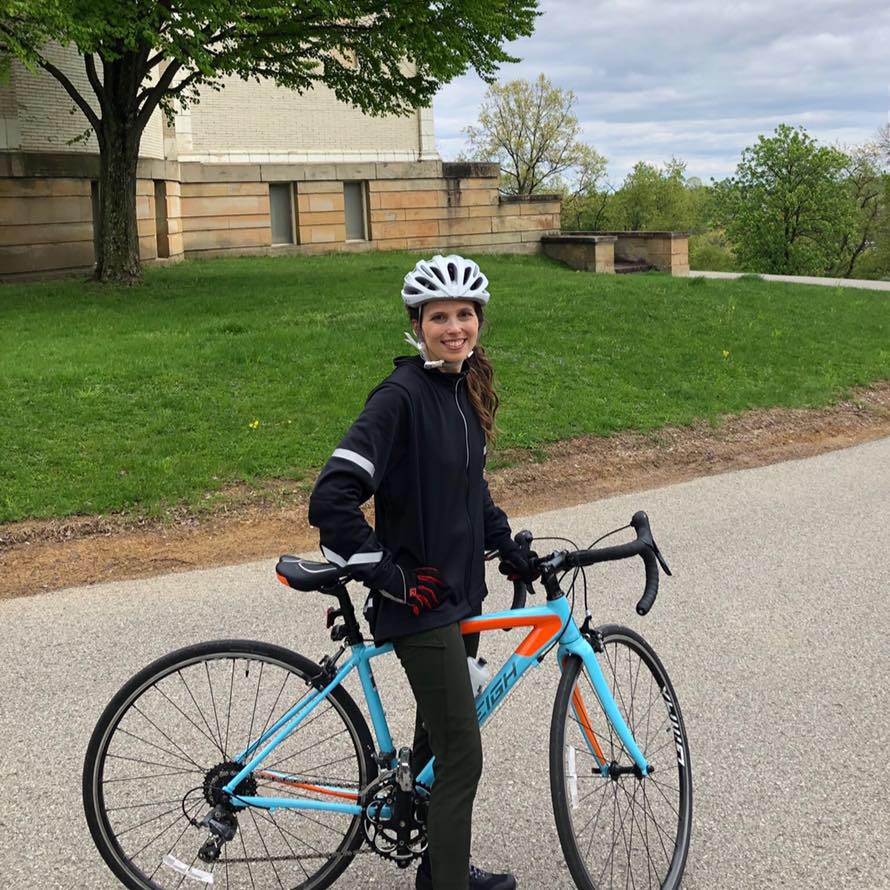 Dr. Melanie Good outside the Allegheny Observatory with her bike.